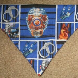 A blue triangular fabric with superhero-themed comic panels and rings.