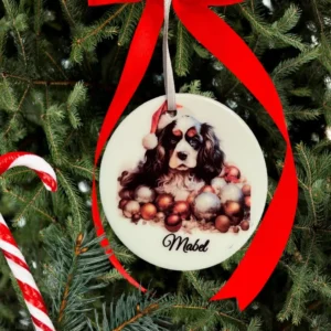 Dog ornament with red ribbon on tree.